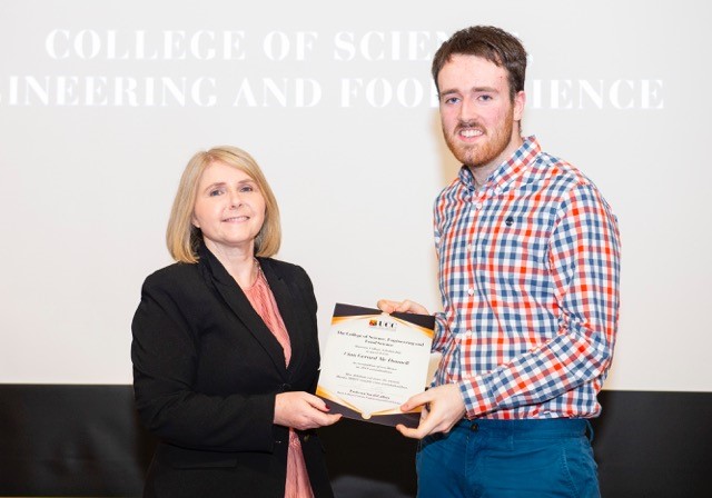 Student receiving award
