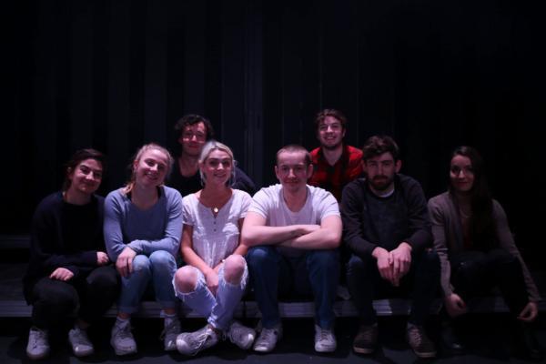 Cast and Crew of Disco Pigs pose for a photo on stage