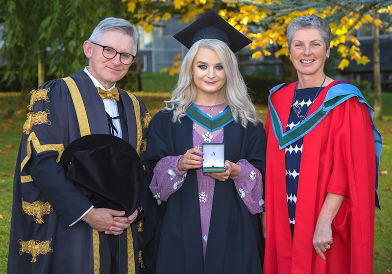 Professor Patrick O'Shea, President of University College Cork; Róisín Cassidy, 2018 recipient of the Art Champlin Gold Medal – awarded annually to the top student graduating BSc (Hons) in Biochemistry; and Professor Rosemary O'Connor, Head of School of Biochemistry and Cell Biology, UCC.