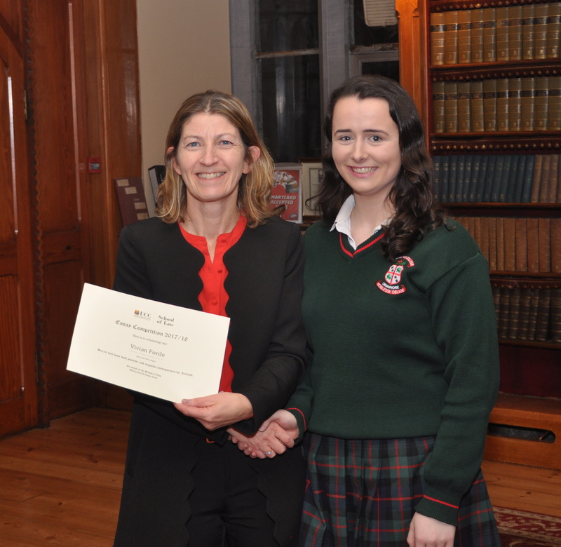 Vivian Forde being presented with a certificate by Professor Ursula Kilkelly