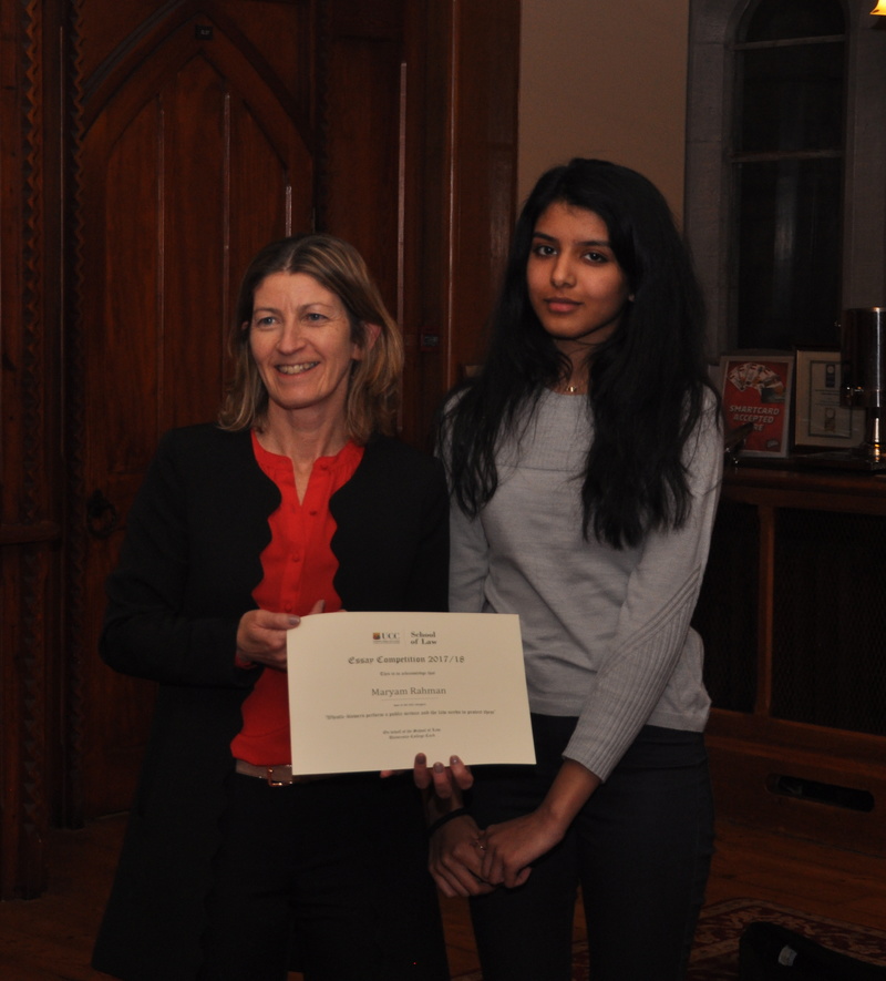 Maryam Rahman being presented with a certificate by Professor Ursula Kilkelly