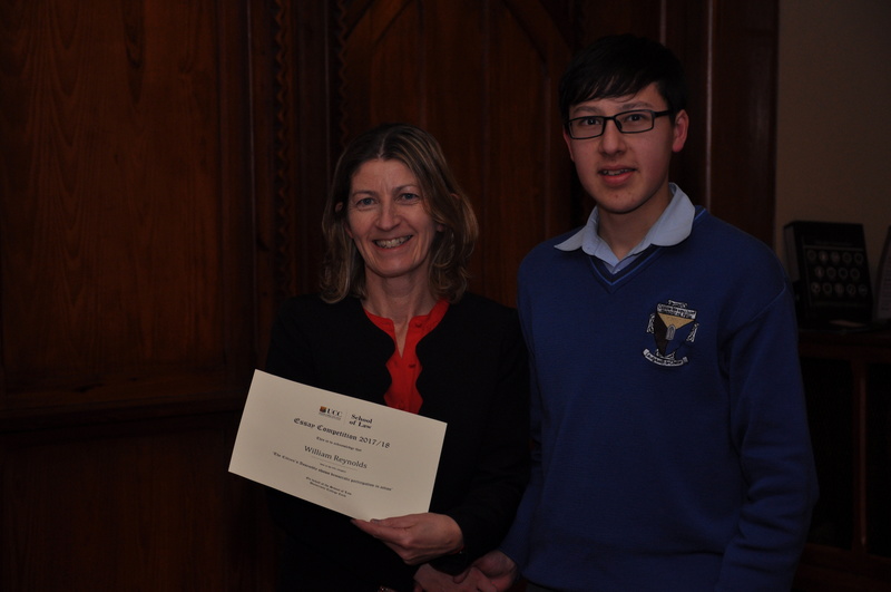 William Reynolds being presented with a certificate by Professor Ursula Kilkelly