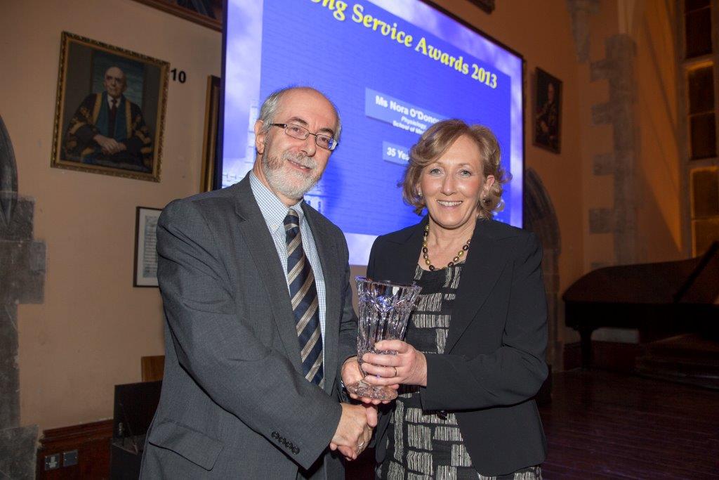 Nora O'Donovan being presented with her 35 year award by Registrar Prof.Paul Giller

