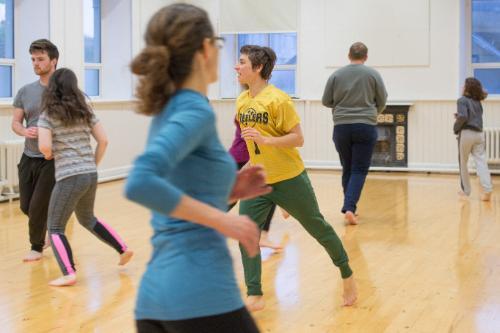 Students running in their theatre class