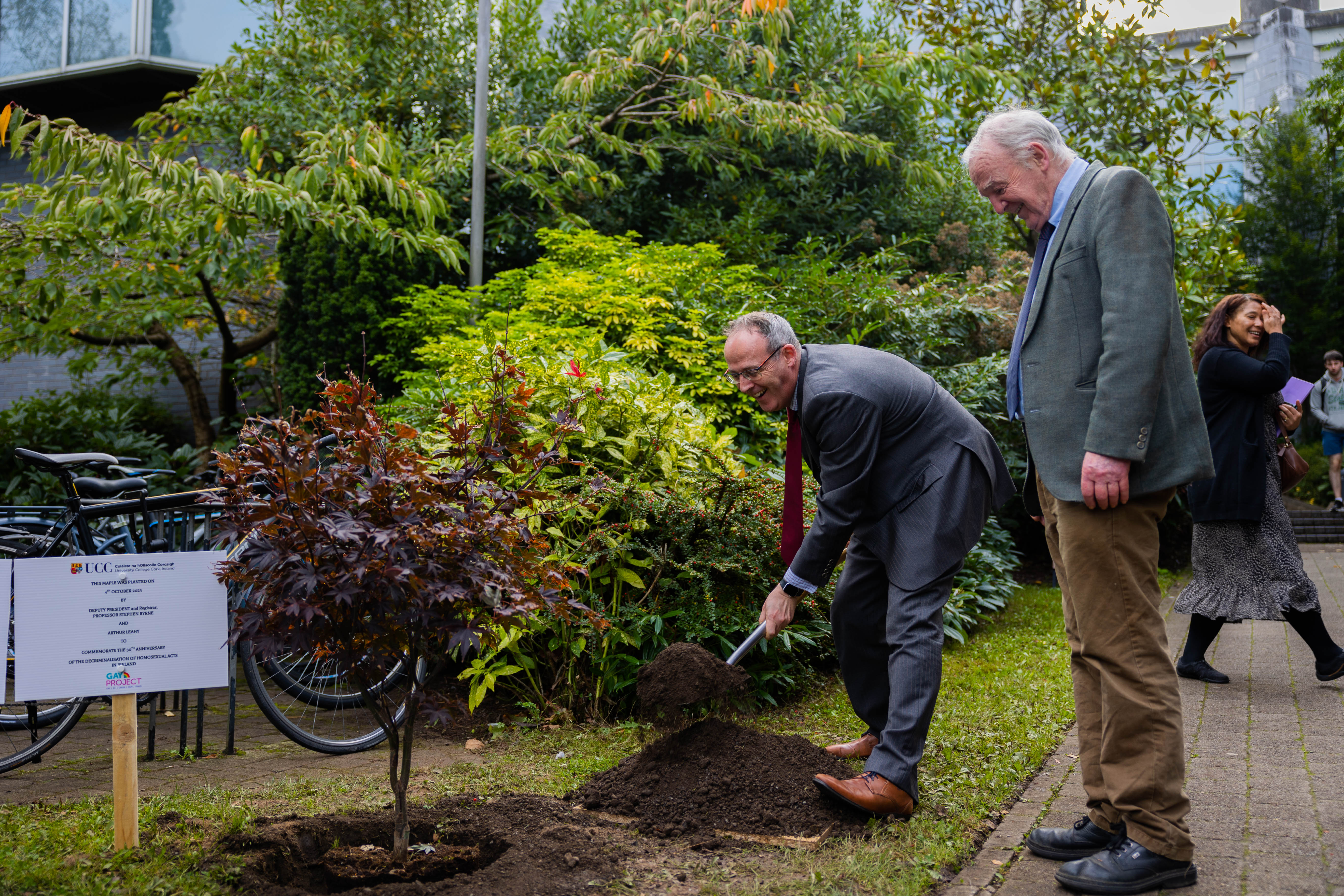 The DPR Professor Stephen Byrne and Arthur Leahy from the Quay Co-op take turns planting the new tree.