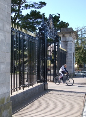 cyclist leaving UCC Main Gate to Western Road