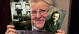 Mim O’Donovan with a photograph of Michael Collins as he departed for Béal na Bláth and a portrait of her aunt Agnes Hurley, who took the picture of Collins. (Image by Denis Boyle)