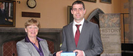Professor Catherine O’Brien presenting a prize to Robert Honohan, winner of the John B. O’Brien Annual Prize in History.