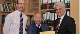 Professor P F Fitzpatrick & Dr E Byrne presenting Dr Tom Kelly with his Outstanding Lecturer Award