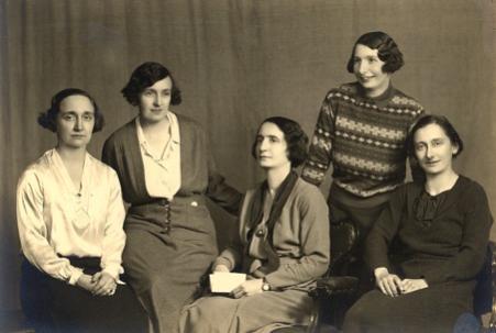 A sepia family photo of five women