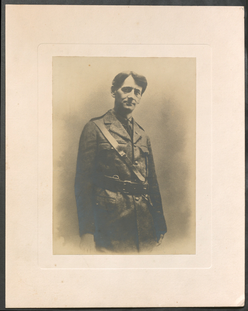 A sepia-coloured photo of a man in military uniform