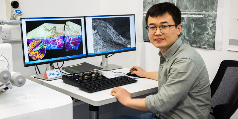 Dr Zixiao Yang of University College Cork, who discovered that some feathered dinosaurs had scaly skin like reptiles today, thus shedding new light on the evolutionary transition from scales to feathers. Image credit: Ruben Tapia/UCC TV