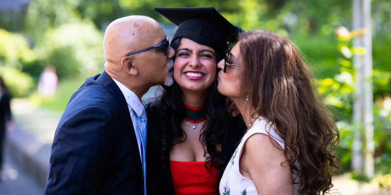 Sanjív Talwar and family celebrate today's conferrings. Photo by Rubén Tapia, UCCTV