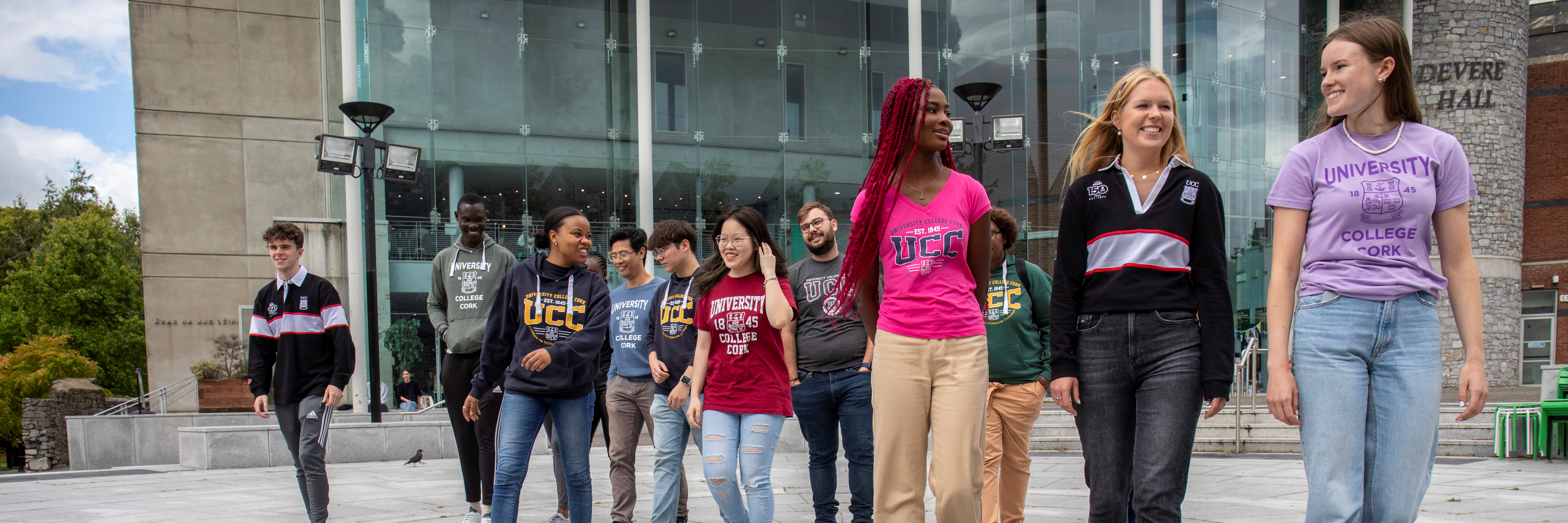 image of students walking through the plaza outside the student centre at UCC