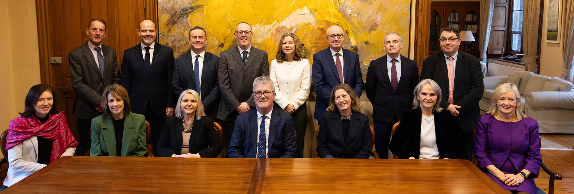 Image of the University Leadership Team members at a meeting table