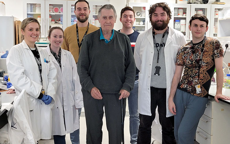 Dr Patrick Leonard visiting with postgraduate students in one of our postgraduate labs in the School of Biochemistry and Cell Biology