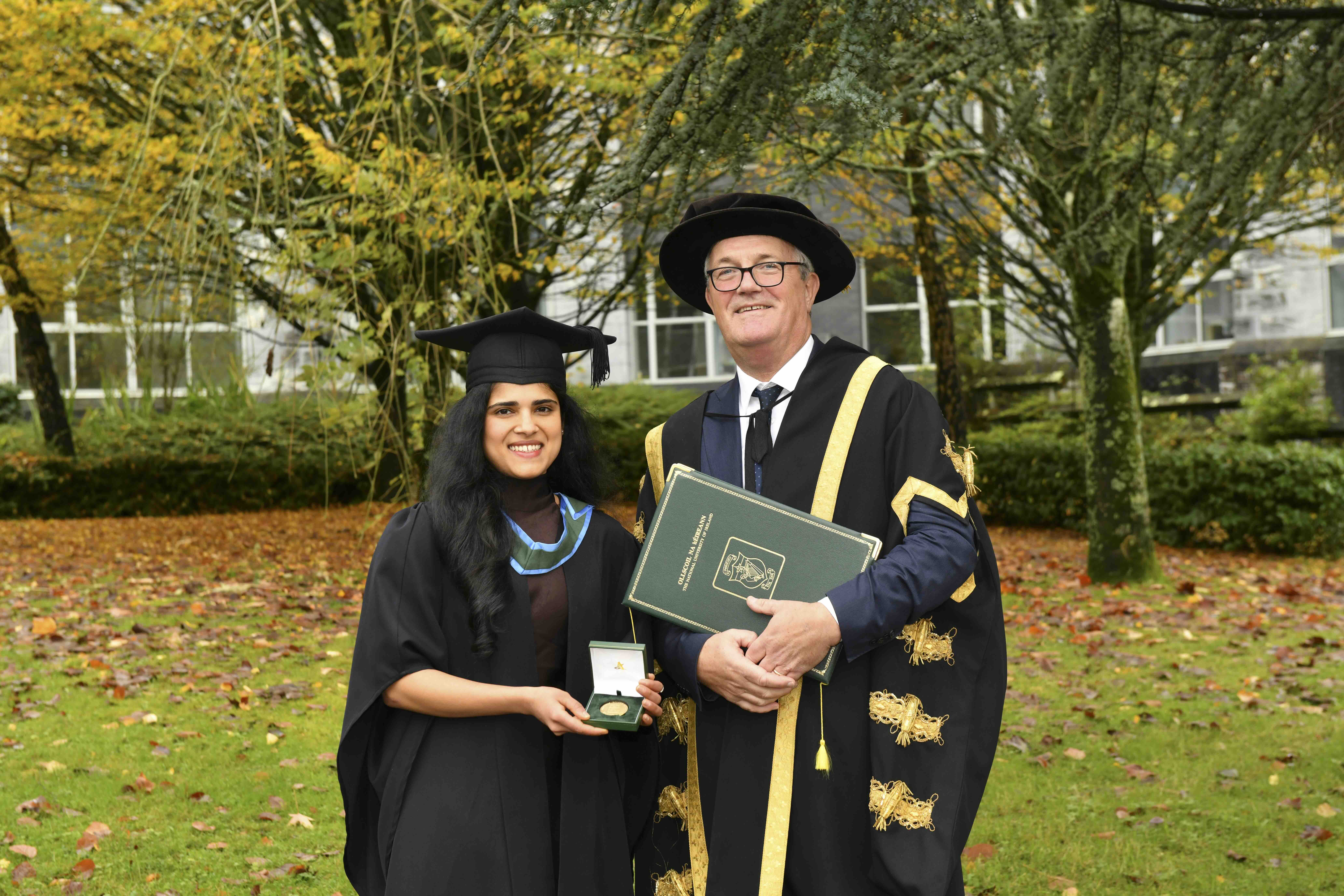 Iris Carvalho with UCC President at graduation receiving an award