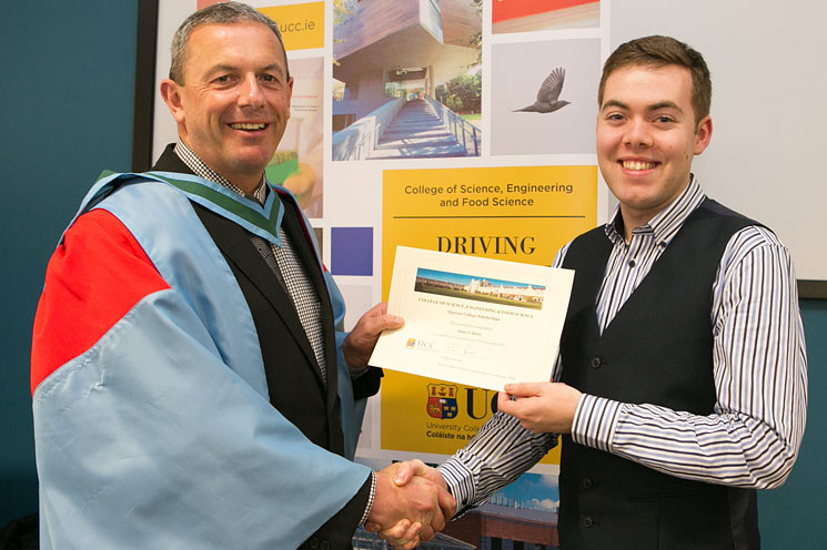 Professor Paul Ross, Head of College of Science, Engineering and Food Science (SEFS), University College Cork (UCC) presents James Harte with a Quercus College Scholarship in recognition of his exceptional results in First Year Biomedical Science.