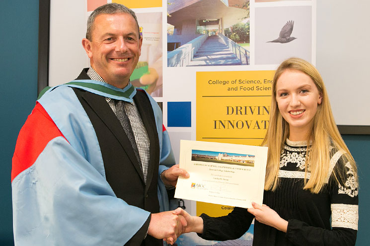 Professor Paul Ross, Head of College of Science, Engineering and Food Science (SEFS), University College Cork (UCC) presents Carolyn Murray with a Quercus College Scholarship in recognition of her exceptional results in Third Year Biochemistry.