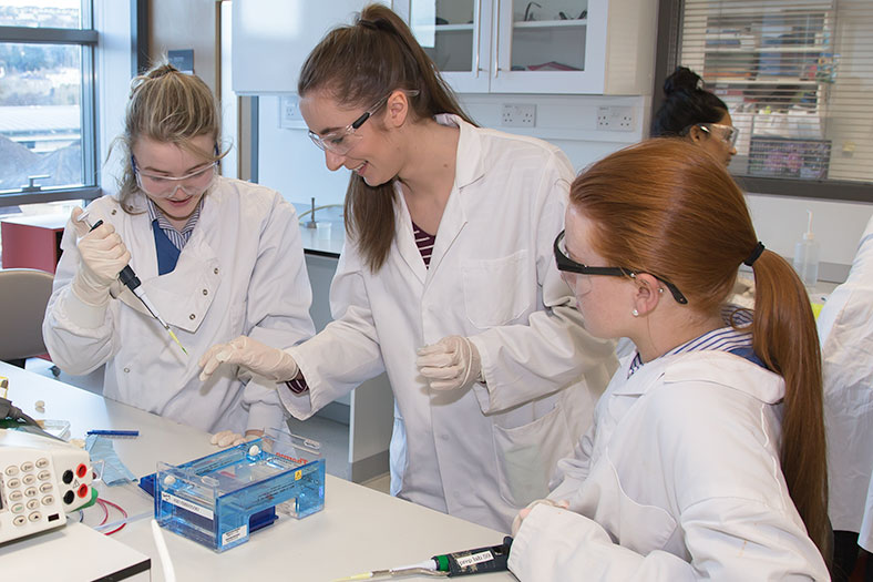 Orla Brosnan, 4th year Biochemistry student, demonstrates to a secondary school student from Christ King Secondary School at the DNA workshop held in the School of Biochemistry, UCC