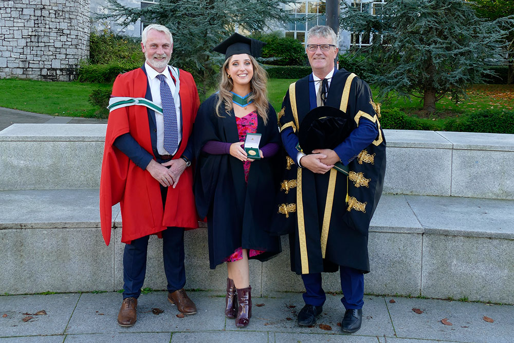 Professor Justin McCarthy, Head of School of Biochemistry and Cell Biology, UCC; Niamh Casey, BSc Biochemistry Graduate and 2020 recipient of the Art Champlin Gold Medal award; and UCC President, Professor John O'Halloran