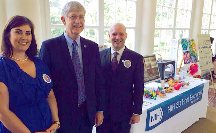 Dr Meghan Coakley (left), formerly School of Biochemistry and Cell Biology, and Dr Darrell Hurt (right) of the NIH 3D Print Exchange, with NIH Director Dr Francis Collins (centre), at the White House Maker Faire on 18 June 2014.