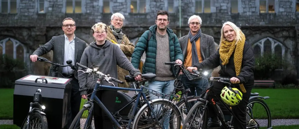 A group of people from Socio-Cycle with bicycles in UCC President's Garden