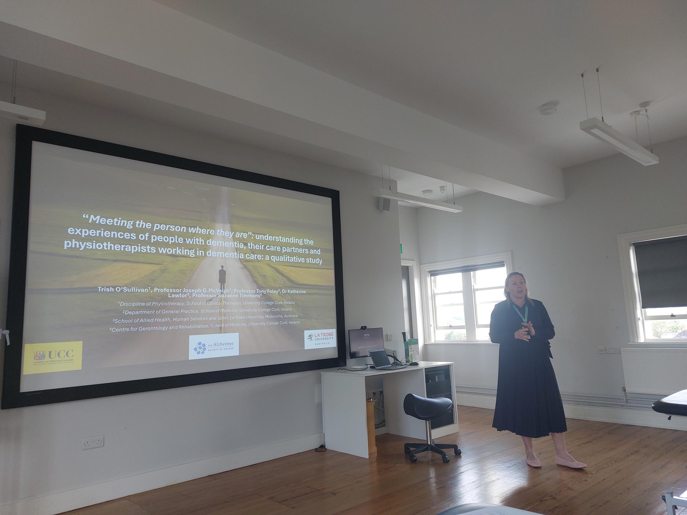 Trish O'Sullivan standing infront of a presentation being displayed on a wall Trish O'Sullivan standing infront of a presentation being displayed on a wall