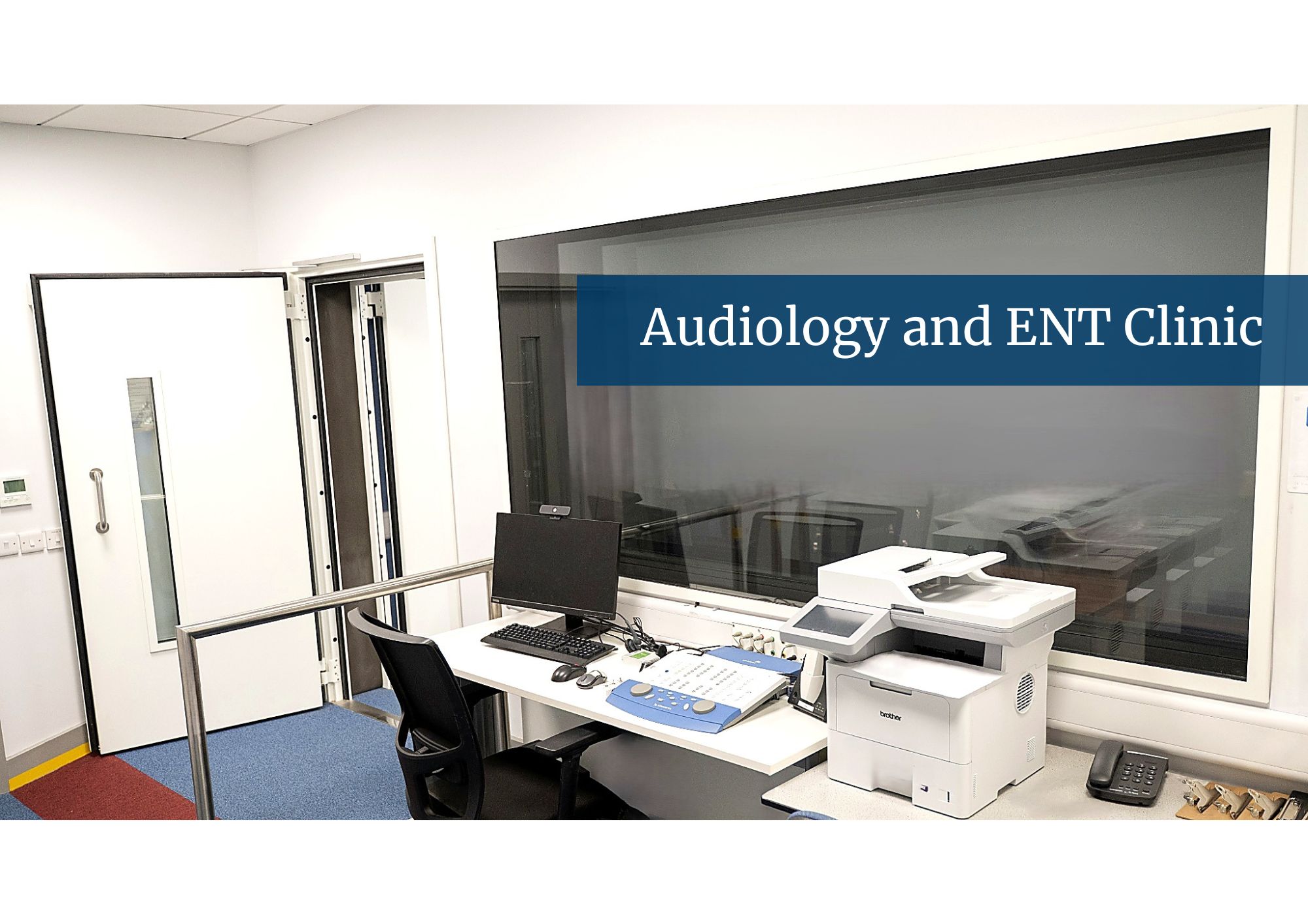 Picture of the Audiology clinic booth with a banner saying 