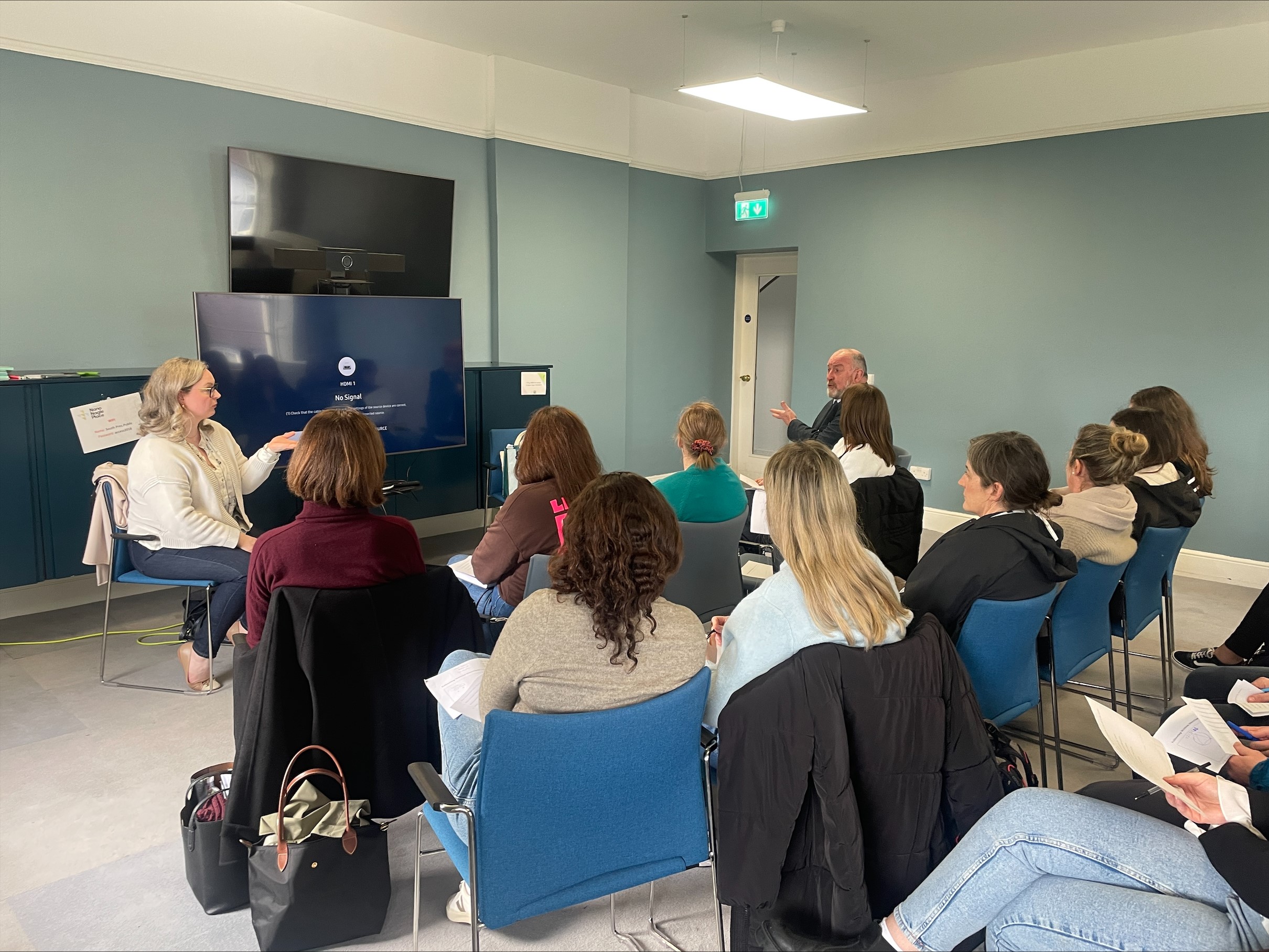Group of students seated in a classroom infront of Lecturer Emma Gleeson and visiting speaker