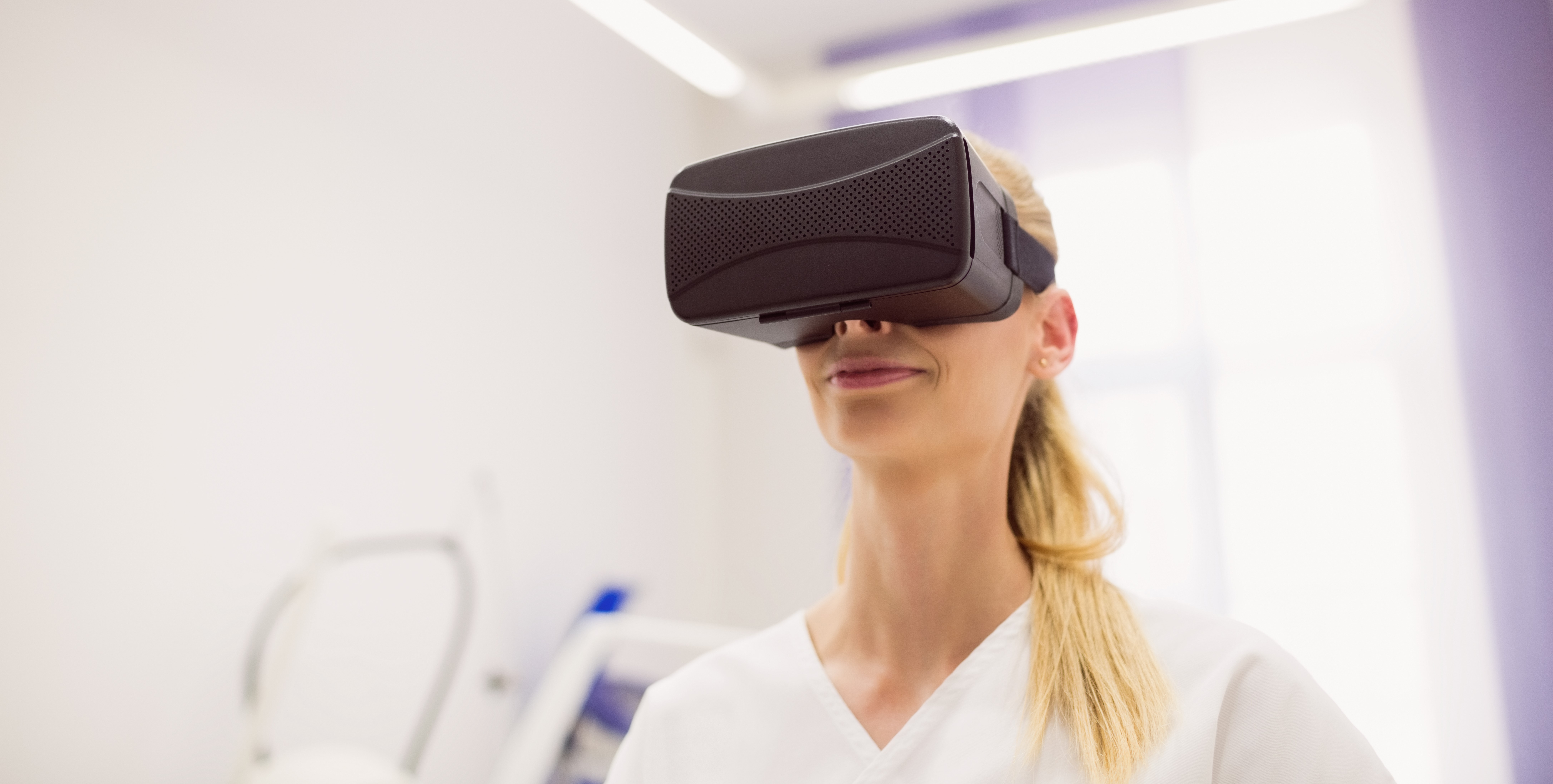 Female doctor wearing VR headset