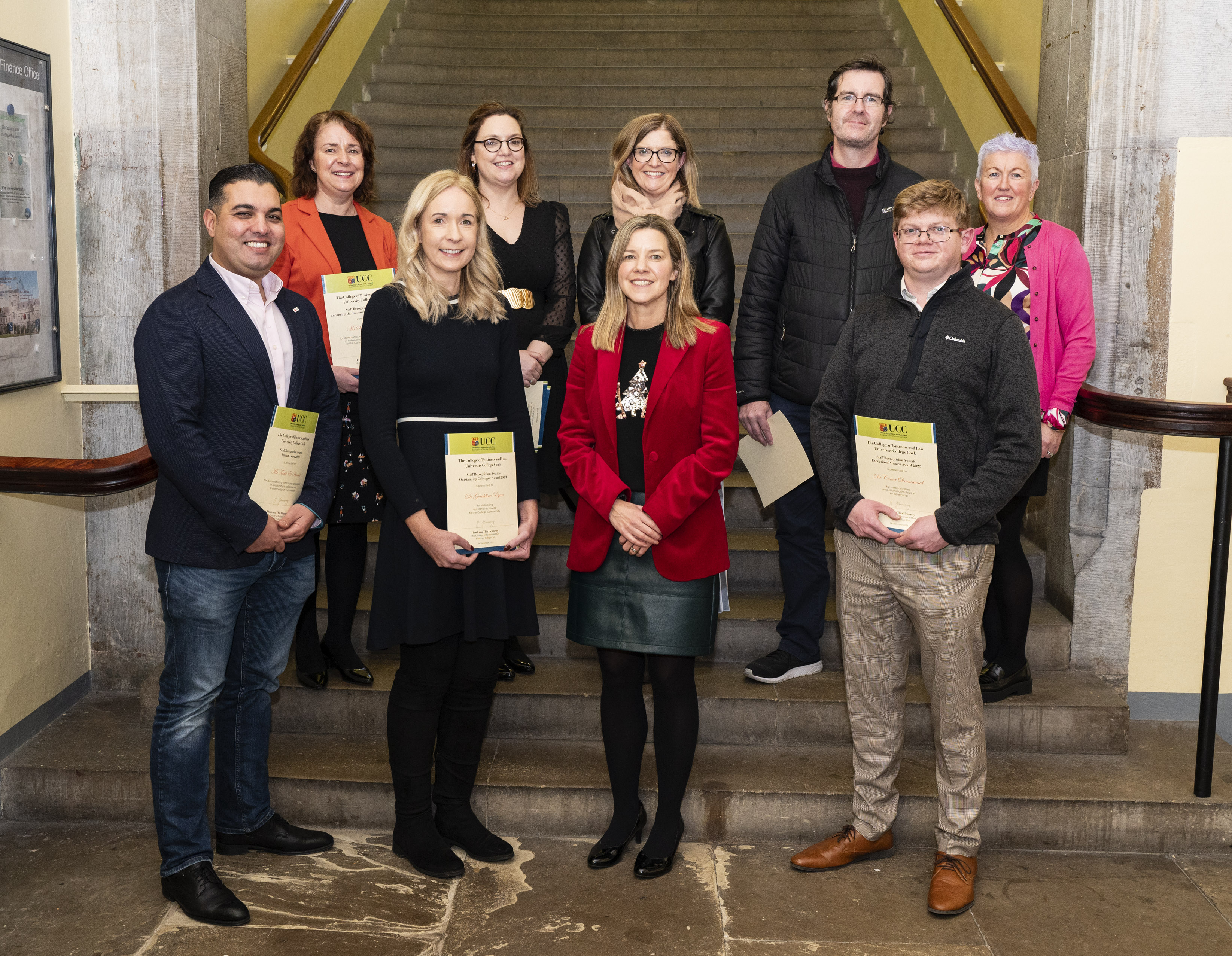 College Staff Recognition Award Recipients pictured at College Assembly 14 December 2023:  (front l-r) Tarik El Amoud, Dr Geraldine Ryan, Head of College Professor Thia Hennessy, Dr Conor Drummond; (back l-r) Ms Sinead Hackett, Dr Jane Bourke, Professor Ciara Heavin, Dr Paidi O'Reilly, HR Business Manager Ms Mags Walsh.  Not pictured are Award Recipients  Ms Ber Madden and Professor Louise Crowley.