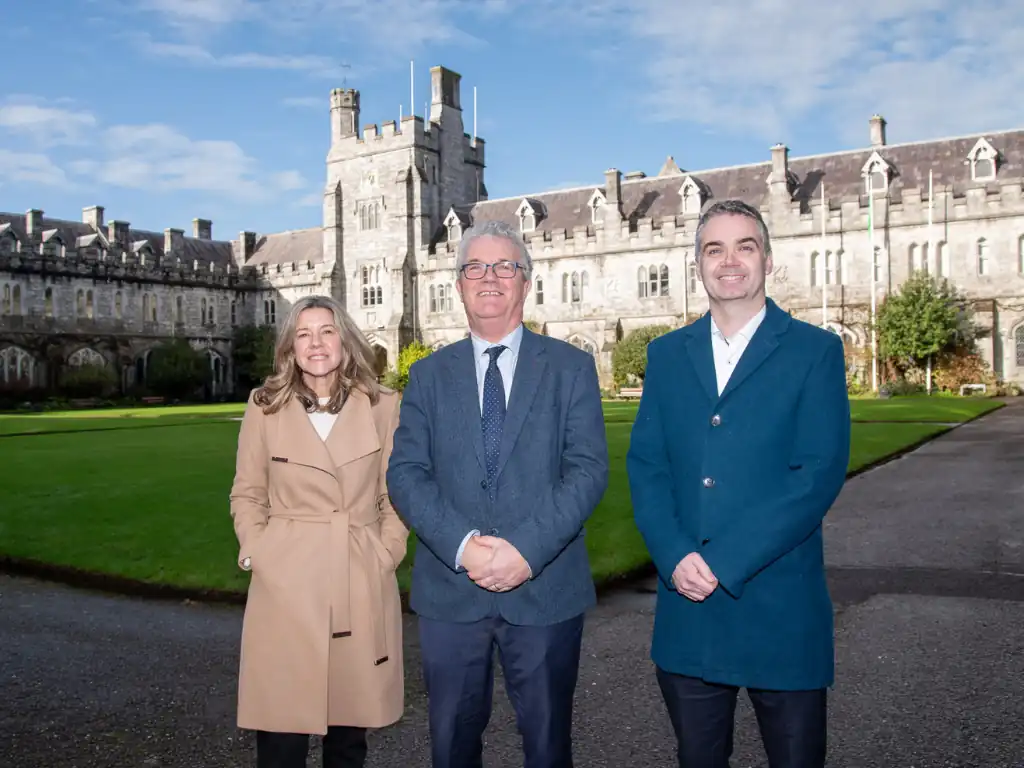 Image of three UCC staff in front of quad