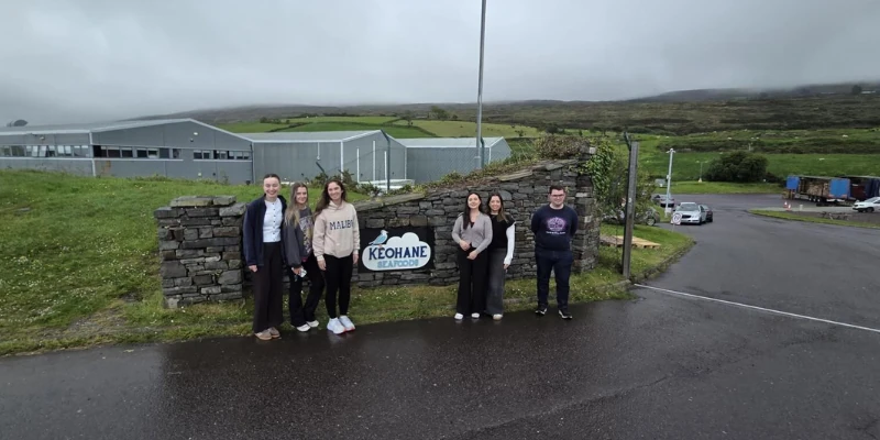 Image of people posing outside of Keohane Seafoods Image of people posing outside of Keohane Seafoods