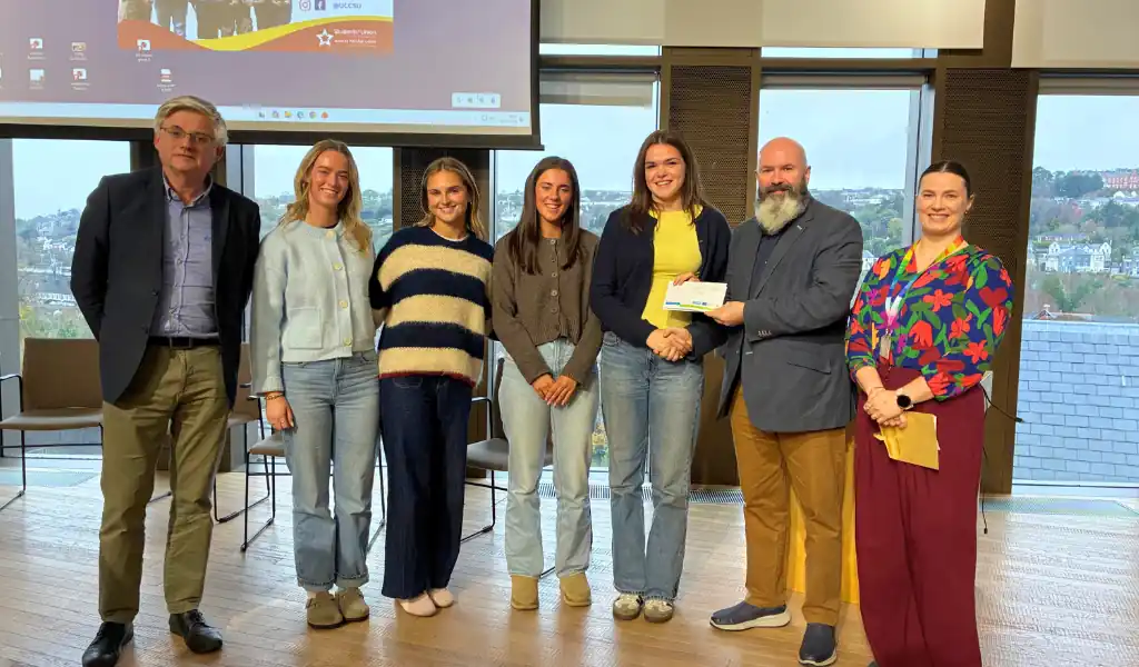 Photo of students smiling and accepting an award Photo of students smiling and accepting an award