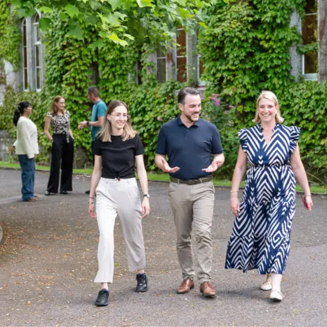 Students walking together through main campus.