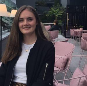 UCCDH student Edel Lonergan sitting in a chair