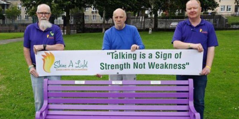 (Left to right) Joe D'Alton, Tom "Golly" Flynn and Cllr Mick Nugent of Shine A Light Suicide & Mental Health Awareness at a new friendship bench initiative in Cork last July. Picture: Denis Minihane. The Irish Examiner.