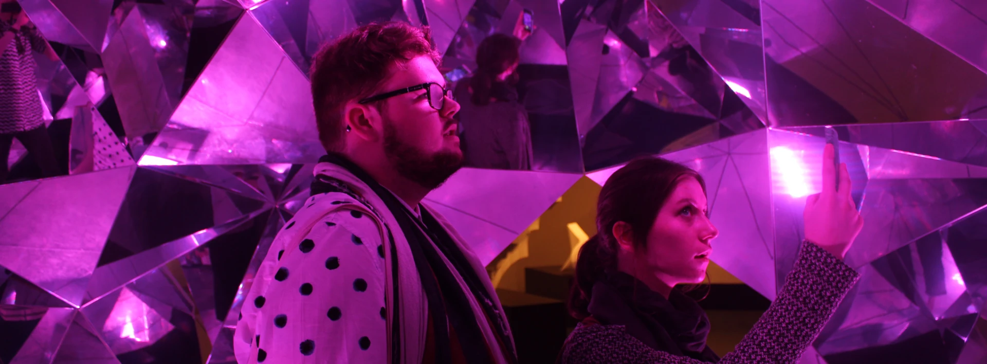 Student in purple light