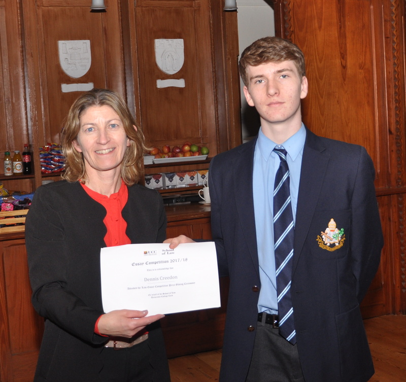 Denis Creedon accepting a certificate from Professor Ursula Kilkelly