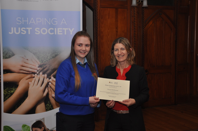 Sinead McWeeney being presented with a certificate by Professor Ursula Kilkelly