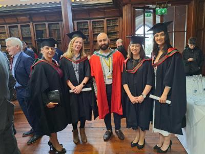 Students pose in Aula Max