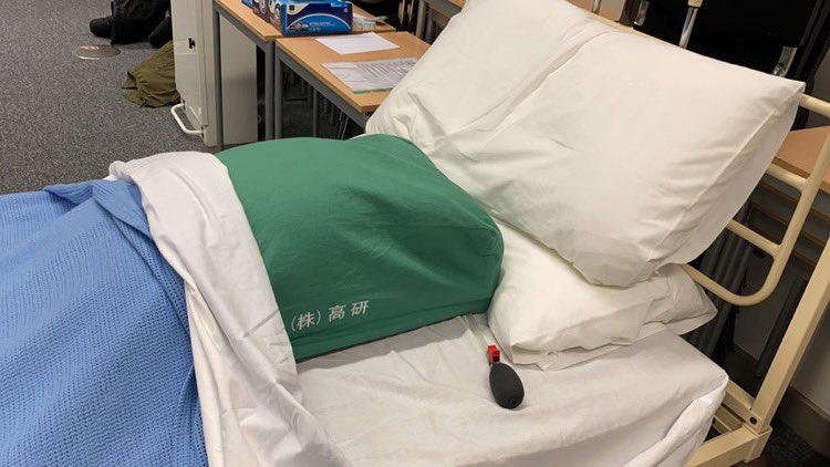 Bed featuring a pillow rather than a patient for exams 2020 due to COVID-19