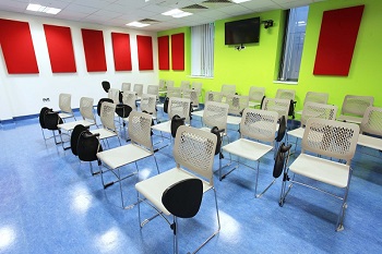The tutorial room is set out with chairs in rows