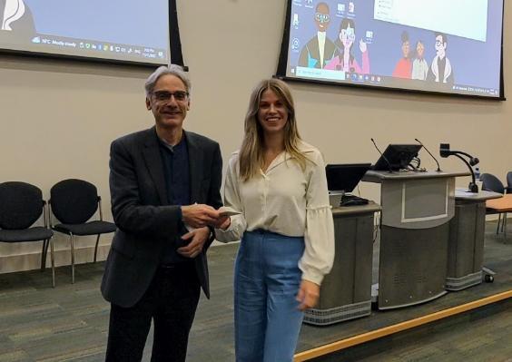 man giving prize to woman