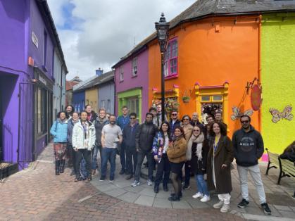 Group photo infront of colourful buildings in Kinsale, Cork