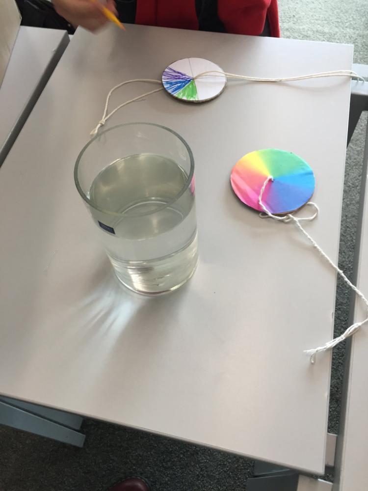 Image of jar of water and a cardboard colour wheel