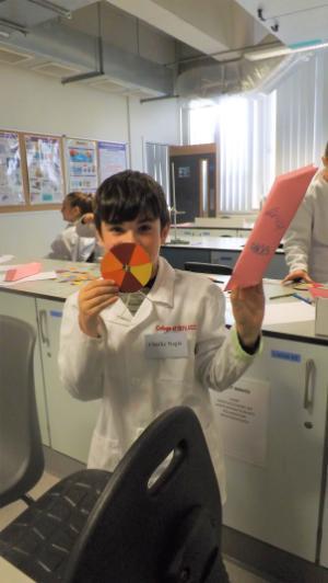 A student holding his colour wheel and periscope