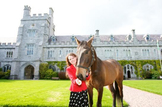 Keen horsewoman and marine biologist, Sarah O’Sullivan with the horse Cody. (This is not the first horse to grace UCC’s Quad. The horses of previous Presidents were stabled on campus. The converted stables still exist as does the large stone for mounting the horses.) PHOTO: Donagh Glavin