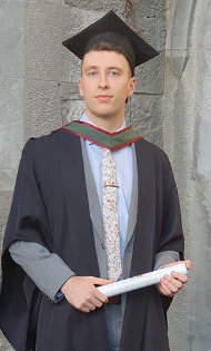 Graduate holding a parchment